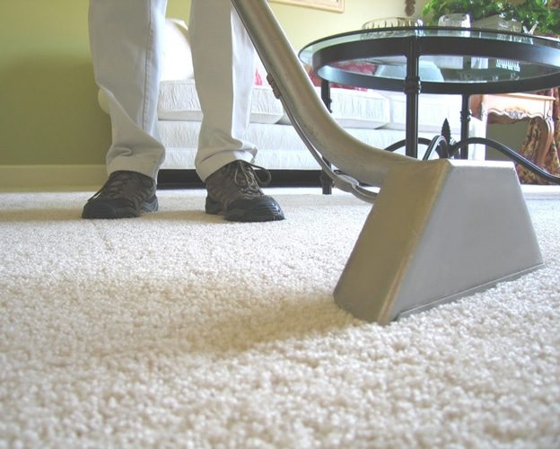 Man Using Rug Cleaner — Professional Carpet Cleaners in Gold Coast, QLD