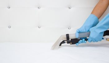 Cleaning Mattress Using Vacuum — Professional Carpet Cleaners in Gold Coast, QLD