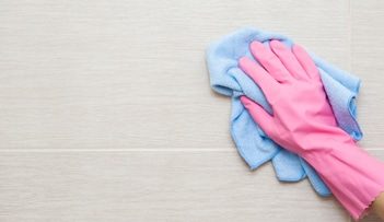 Wiping Tiles With Gloves — Professional Carpet Cleaners in Gold Coast, QLD